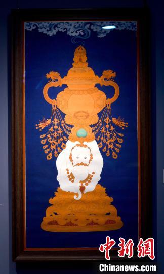 圖為5月16日，展覽中的新創(chuàng)唐卡作品《瑞象承香》?！±盍?攝
